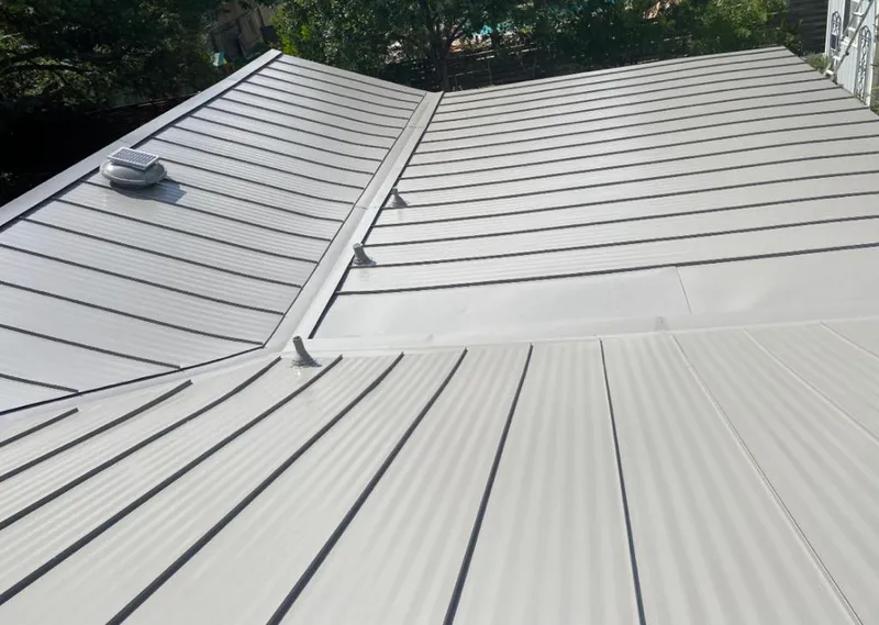 Solar attic fan installed on a metal roof for Roof Ventilation in Hood River